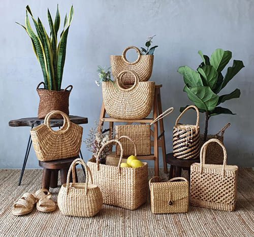 group of woven handbag standing on the floor