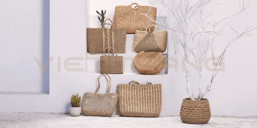 Seagrass handbags and totes displayed on wall shelves in a bright showroom