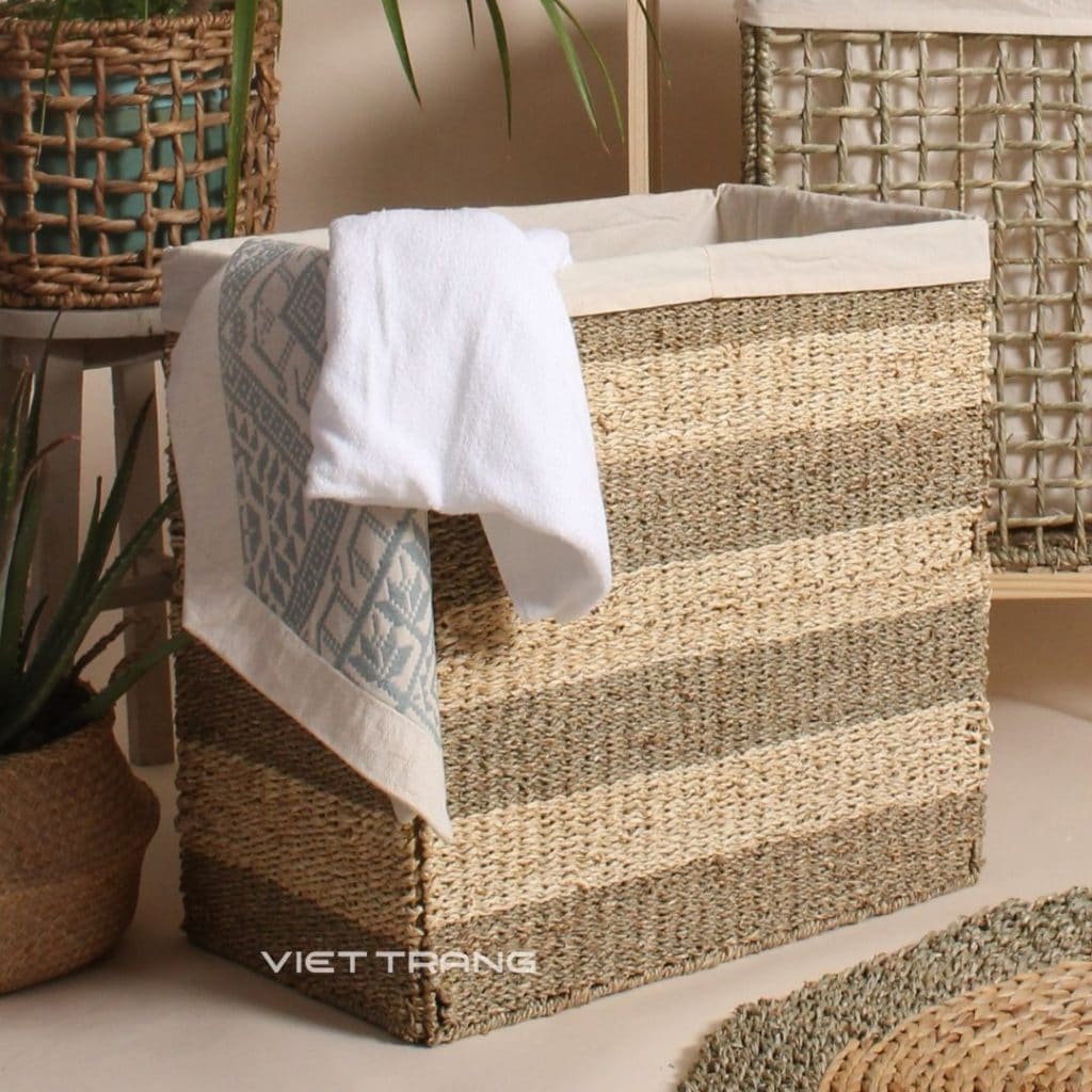 Striped water hyacinth laundry hamper with a cotton liner, made by Viet Trang for retail