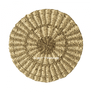 Round kitchen placemat woven from palm leaf and seagrass in natural brown and white.
