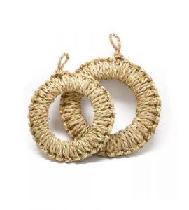 Small round seagrass placemat in a natural brown tone, handwoven in Vietnam.