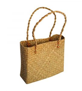 Rectangular seagrass beach handbag in a golden straw weave, handmade in Vietnam.
