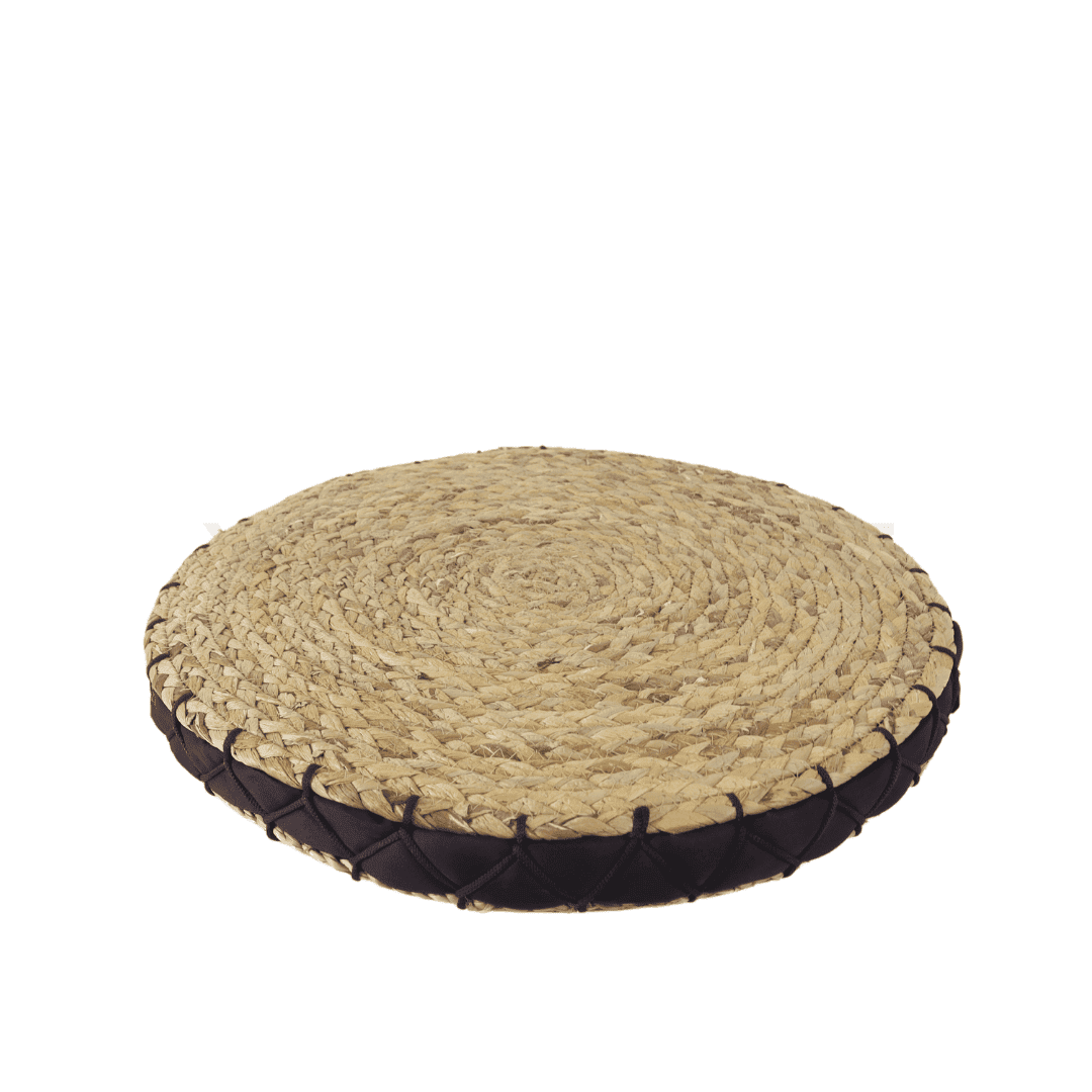 Round water hyacinth seat cushion viewed from above on a white background