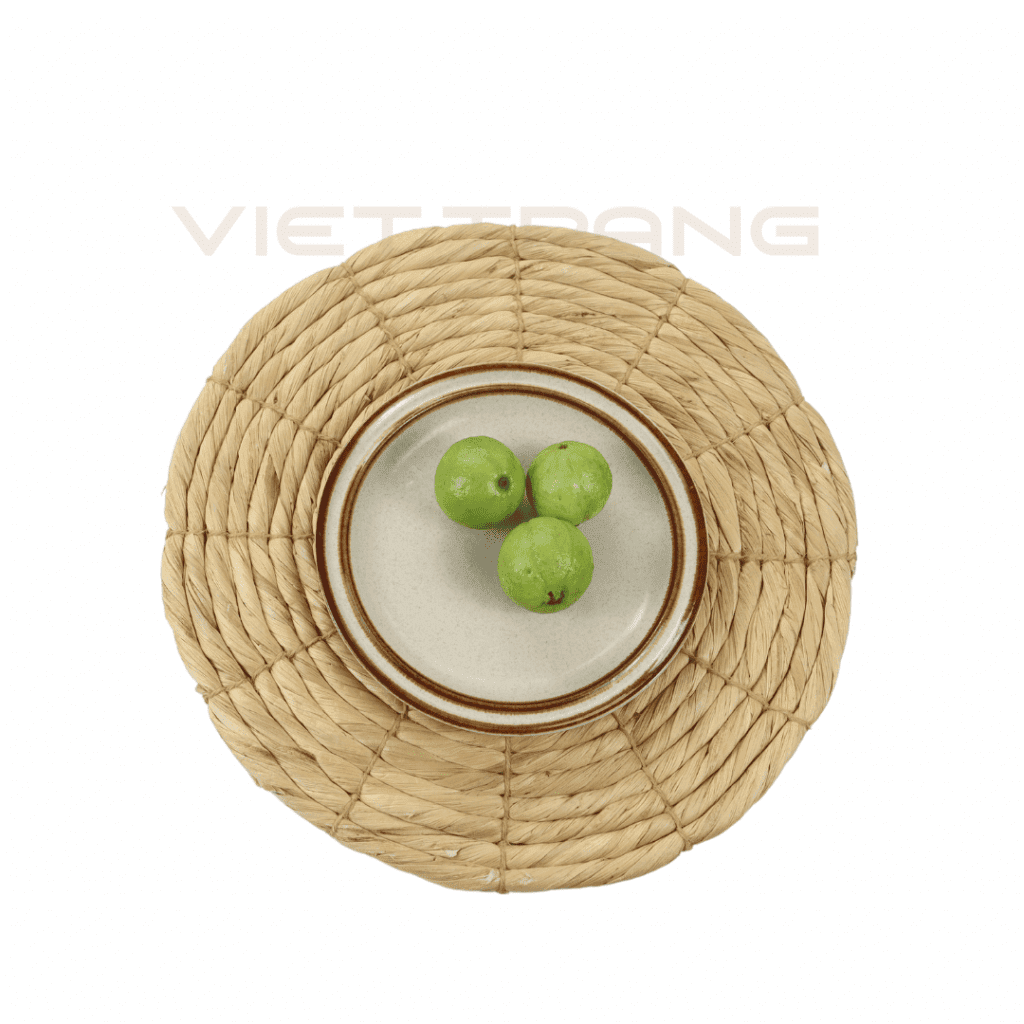 Plain round water hyacinth placemat with a spiral weave, handwoven in Vietnam.